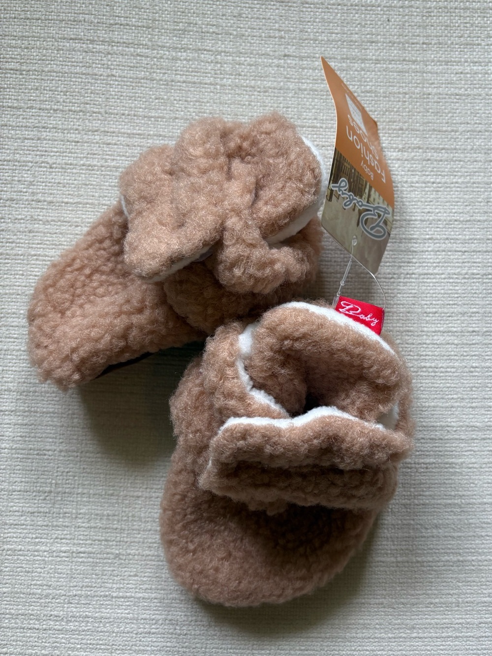 Cozy Plush Baby Booties in soft blush pink taupe